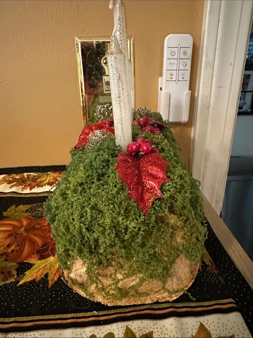 Moss-Covered Holiday Centerpiece with Red Mushroom Accents